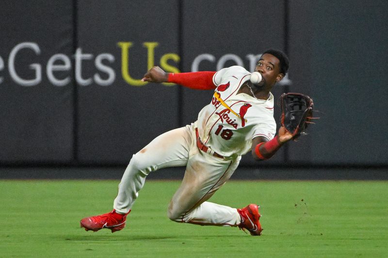 Sep 2, 2023; St. Louis, Missouri, USA;  St. Louis Cardinals right fielder Jordan Walker (18) slides and catches a line drive hit by Pittsburgh Pirates right fielder Connor Joe (not pictured) during the seventh inning at Busch Stadium. Mandatory Credit: Jeff Curry-USA TODAY Sports