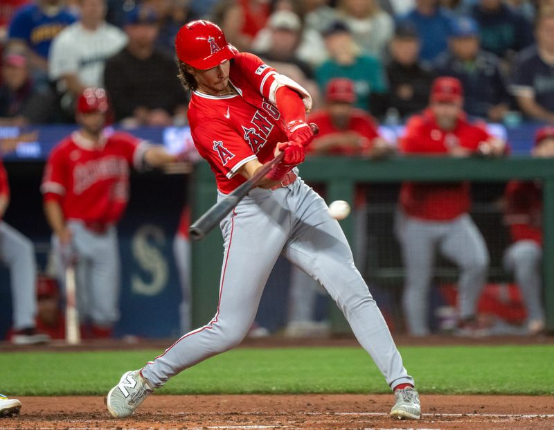 Sep 12, 2025; Seattle, Washington, USA; Los Angeles Angels centerfielder Bryce Teodosio (22) hits a single during the third inning at T-Mobile Park. Mandatory Credit: Stephen Brashear-Imagn Images