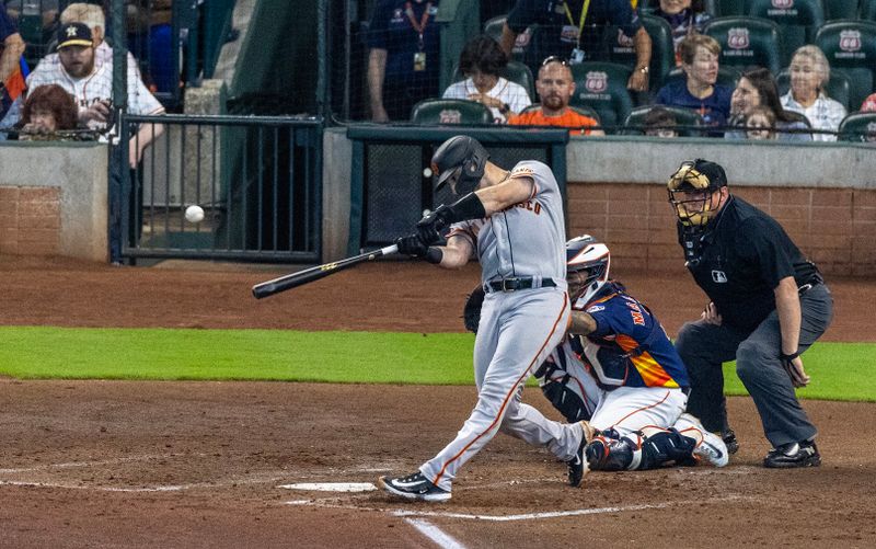 May 3, 2023; Houston, Texas, USA; San Francisco Giants catcher Joey Bart (21) hits a single against Houston Astros in the sixth inning at Minute Maid Park. Mandatory Credit: Thomas Shea-USA TODAY Sports