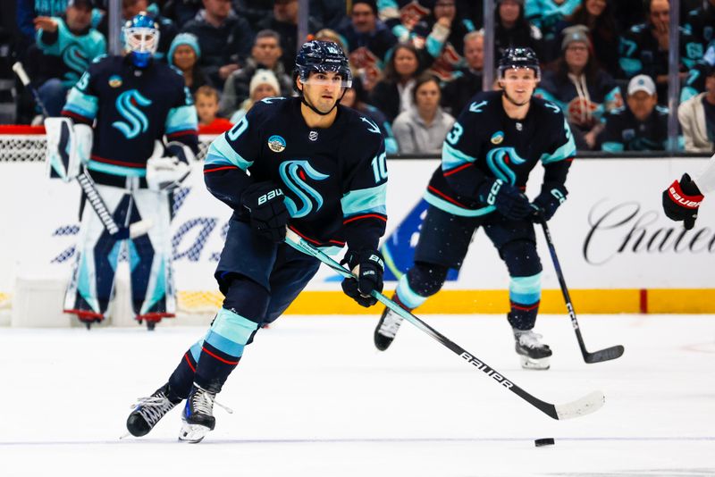 Jan 4, 2024; Seattle, Washington, USA; Seattle Kraken center Matty Beniers (10) skates with the puck against the Ottawa Senators during the second period at Climate Pledge Arena. Mandatory Credit: Joe Nicholson-USA TODAY Sports