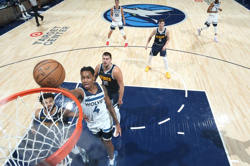 MINNEAPOLIS, MN -  OCTOBER 17: Rob Dillingham #4 of the Minnesota Timberwolves drives to the basket during the game against the Denver Nuggets during the 2024 NBA Preseason on October 17, 2024 at Target Center in Minneapolis, Minnesota. NOTE TO USER: User expressly acknowledges and agrees that, by downloading and or using this Photograph, user is consenting to the terms and conditions of the Getty Images License Agreement. Mandatory Copyright Notice: Copyright 2024 NBAE (Photo by David Sherman/NBAE via Getty Images)