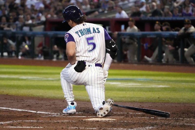 Aug 13, 2023; Phoenix, Arizona, USA; Arizona Diamondbacks center fielder Alek Thomas (5) reacts after being hit by a pitch against the San Diego Padres during the third inning at Chase Field. Mandatory Credit: Joe Camporeale-USA TODAY Sports