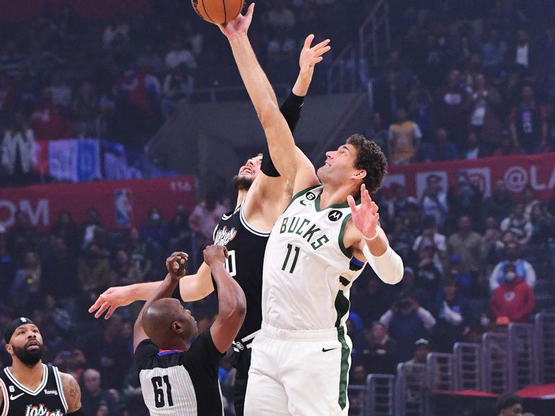 LOS ANGELES, CA - FEBRUARY 10: Brook Lopez #11 of the Milwaukee Bucks during tip off against the LA Clippers on February 10, 2023 at Crypto.Com Arena in Los Angeles, California. NOTE TO USER: User expressly acknowledges and agrees that, by downloading and/or using this Photograph, user is consenting to the terms and conditions of the Getty Images License Agreement. Mandatory Copyright Notice: Copyright 2023 NBAE (Photo by Adam Pantozzi/NBAE via Getty Images)