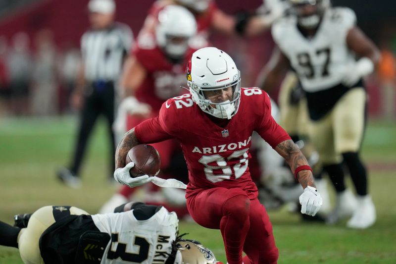 Arizona Cardinals wide receiver Andre Baccellia (82) is tackled by New Orleans Saints cornerback Kool-Aid McKinstry on a pass reception in the second half of a preseason NFL football game, Saturday, Aug. 10, 2024, in Glendale, Ariz. (AP Photo/Ross D. Franklin)
