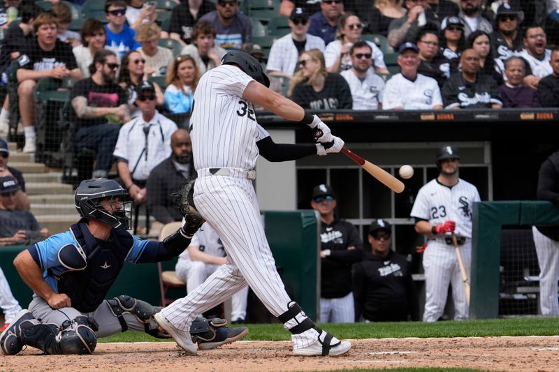 Apr 28, 2024; Chicago, Illinois, USA; Chicago White Sox first base Gavin Sheets (32) hits a single against the Tampa Bay Rays during the eighth inning at Guaranteed Rate Field. Mandatory Credit: David Banks-USA TODAY Sports