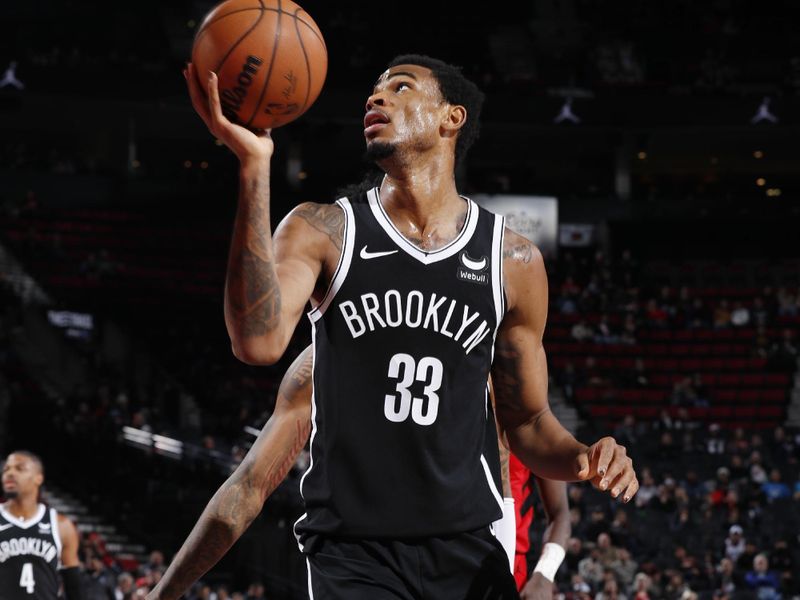 PORTLAND, OR - JANUARY 17: Nicolas Claxton #33 of the Brooklyn Nets looks to shoot the ball during the game against the Portland Trail Blazers on January 17, 2024 at the Moda Center Arena in Portland, Oregon. NOTE TO USER: User expressly acknowledges and agrees that, by downloading and or using this photograph, user is consenting to the terms and conditions of the Getty Images License Agreement. Mandatory Copyright Notice: Copyright 2024 NBAE (Photo by Cameron Browne/NBAE via Getty Images)