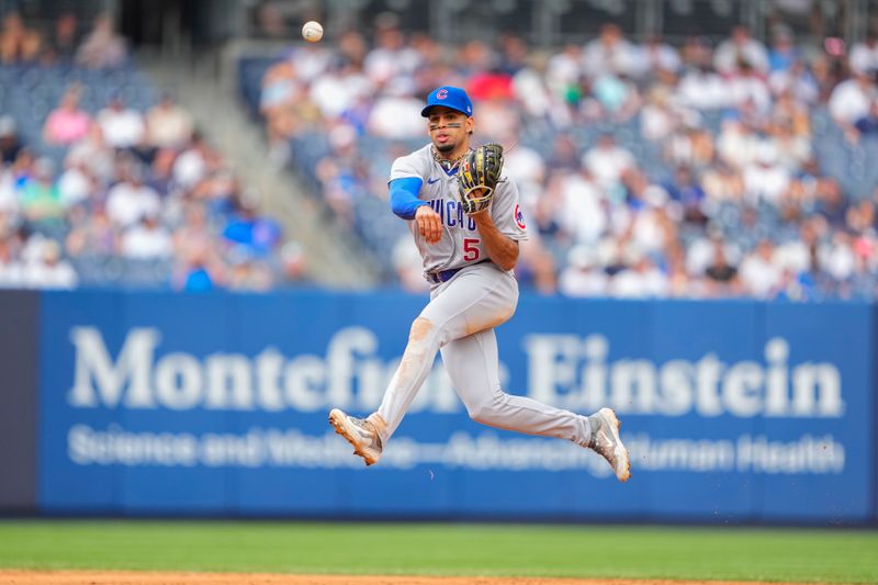 Jul 8, 2023; Bronx, New York, USA; Chicago Cubs second baseman Christopher Morel (5) throws out New York Yankees center fielder Harrison Bader (not pictured) after fielding a ground ball during the eighth inning at Yankee Stadium. Mandatory Credit: Gregory Fisher-USA TODAY Sports