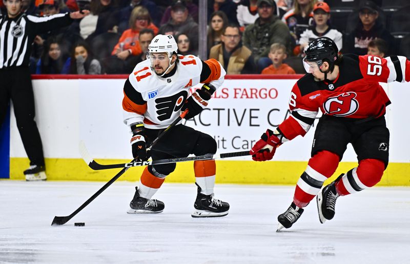 Apr 13, 2024; Philadelphia, Pennsylvania, USA; Philadelphia Flyers right wing Travis Konecny (11) controls the puck against New Jersey Devils left wing Erik Haula (56) in the first period at Wells Fargo Center. Mandatory Credit: Kyle Ross-USA TODAY Sports