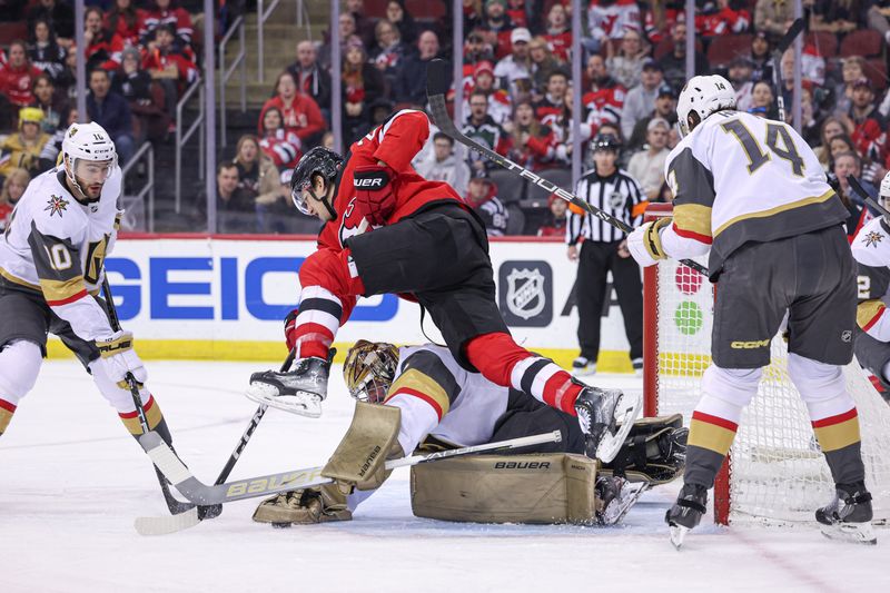 Jan 22, 2024; Newark, New Jersey, USA; Vegas Golden Knights goaltender Logan Thompson (36) makes a save as New Jersey Devils center Michael McLeod (20) leaps during the first period at Prudential Center. Mandatory Credit: Vincent Carchietta-USA TODAY Sports