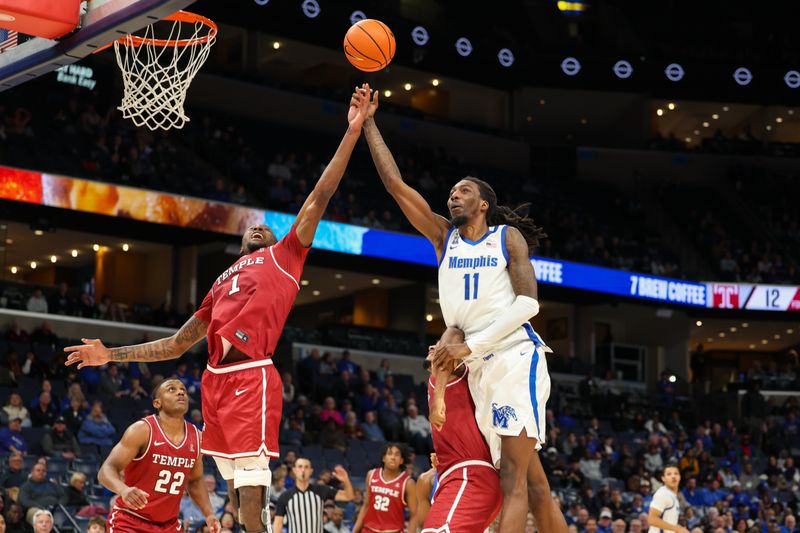 Jan 14, 2026; Memphis, Tennessee, USA; Memphis Tigers forward Aaron Bradshaw (11) shoots the ball against Temple Owls forward Jamai Felt (1) during the first half at FedExForum. Mandatory Credit: Wesley Hale-Imagn Images
