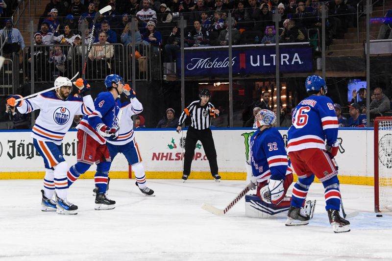 Dec 22, 2023; New York, New York, USA;  Edmonton Oilers left wing Evander Kane (91) celebrates his goal against the New York Rangers during the third period at Madison Square Garden. Mandatory Credit: Dennis Schneidler-USA TODAY Sports