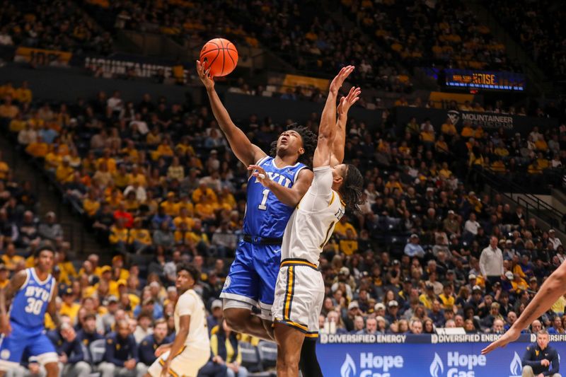 Feb 28, 2026; Morgantown, West Virginia, USA; BYU Cougars guard Robert Wright III (1) shoots against West Virginia Mountaineers guard Jasper Floyd (1) during the first half at Hope Coliseum. Mandatory Credit: Ben Queen-Imagn Images
