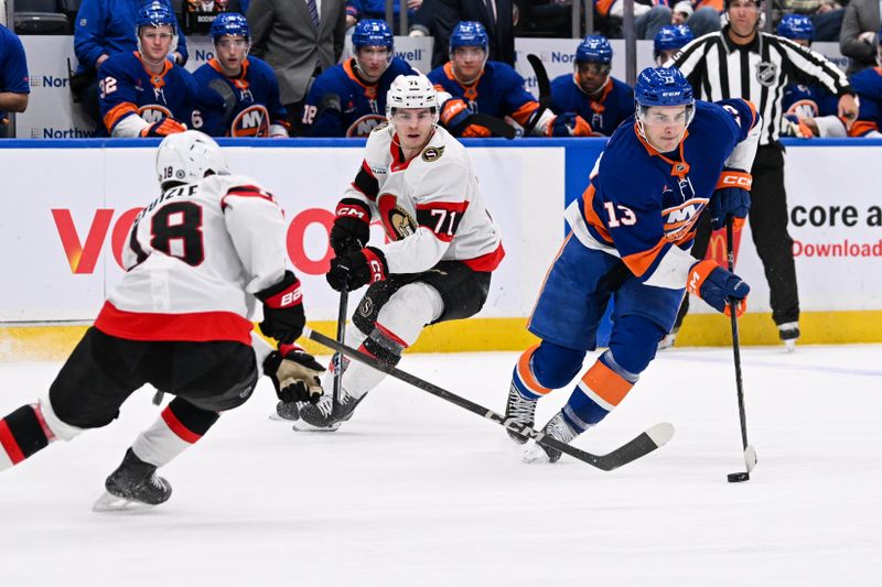 Jan 14, 2025; Elmont, New York, USA;  New York Islanders center Mathew Barzal (13) skates with the puck defended by Ottawa Senators center Tim Stützle (18) during the second period at UBS Arena. Mandatory Credit: Dennis Schneidler-Imagn Images