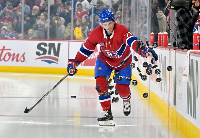 Apr 6, 2024; Montreal, Quebec, CAN; Montreal Canadiens forward Jake Evans (71) dumps the pucks on the ice during the warmup period before the game against the Toronto Maple Leafs at the Bell Centre. Mandatory Credit: Eric Bolte-USA TODAY Sports