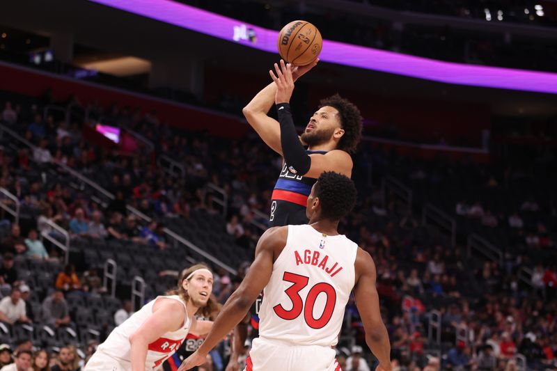 DETROIT, MICHIGAN - MARCH 13: Cade Cunningham #2 of the Detroit Pistons takes a first half shot behind Ochai Agbaji #30 of the Toronto Raptors at Little Caesars Arena on March 13, 2024 in Detroit, Michigan. NOTE TO USER: User expressly acknowledges and agrees that, by downloading and or using this photograph, User is consenting to the terms and conditions of the Getty Images License.  (Photo by Gregory Shamus/Getty Images)