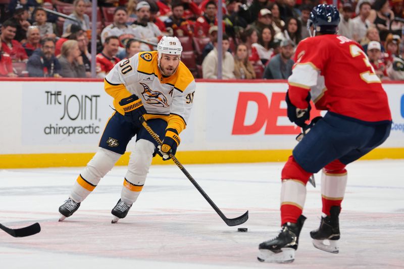 Dec 4, 2025; Sunrise, Florida, USA; Nashville Predators center Ryan O'Reilly (90) moves the puck against the Florida Panthers during the first period at Amerant Bank Arena. Mandatory Credit: Sam Navarro-Imagn Images