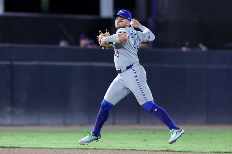 May 24, 2025; Tampa, Florida, USA; Toronto Blue Jays shortstop Bo Bichette (11) throws to first for an out against the Tampa Bay Rays in the eighth inning  at George M. Steinbrenner Field. Mandatory Credit: Nathan Ray Seebeck-Imagn Images