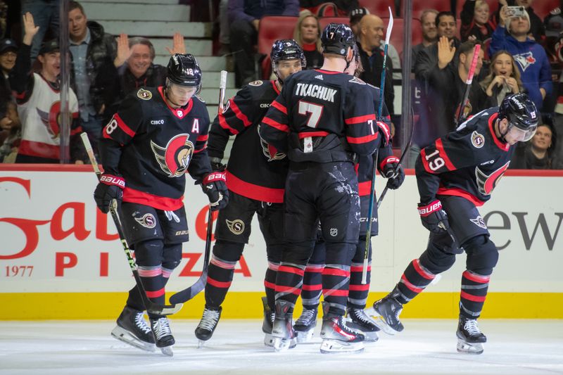 Nov 24, 2023; Ottawa, Ontario, CAN; Ottawa Senators right wing Drake Batherson (19) skates to the bench after celebrating with team his goal scored in the first period against the New York Islanders at the Canadian Tire Centre. Mandatory Credit: Marc DesRosiers-USA TODAY Sports