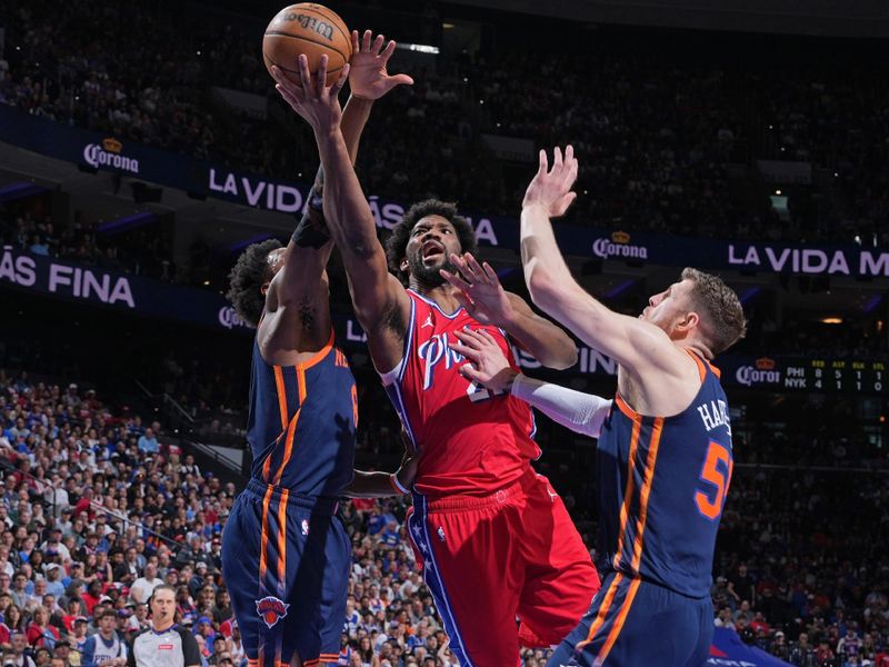 PHILADELPHIA, PA - APRIL 28: Joel Embiid #21 of the Philadelphia 76ers drives to the basket during the game against the New York Knicks during Round 1 Game 4 of the 2024 NBA Playoffs on April 28, 2024 at the Wells Fargo Center in Philadelphia, Pennsylvania NOTE TO USER: User expressly acknowledges and agrees that, by downloading and/or using this Photograph, user is consenting to the terms and conditions of the Getty Images License Agreement. Mandatory Copyright Notice: Copyright 2024 NBAE (Photo by Jesse D. Garrabrant/NBAE via Getty Images)