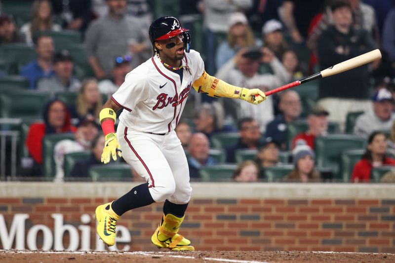 Apr 6, 2024; Atlanta, Georgia, USA; Atlanta Braves right fielder Ronald Acuna Jr. (13) hits a RBI single against the Arizona Diamondbacks in the eighth inning at Truist Park. Mandatory Credit: Brett Davis-USA TODAY Sports