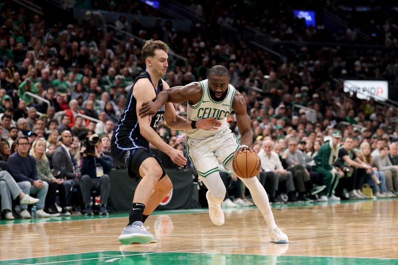 BOSTON, MASSACHUSETTS - APRIL 20: Jaylen Brown #7 of the Boston Celtics drives the ball against Franz Wagner #22 of the Orlando Magic in Game One of the Eastern Conference First Round NBA Playoffs at TD Garden on April 20, 2025 in Boston, Massachusetts. NOTE TO USER: User expressly acknowledges and agrees that, by downloading and or using this photograph, User is consenting to the terms and conditions of the Getty Images License Agreement. (Photo by Maddie Meyer/Getty Images)