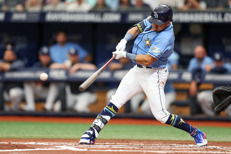 Jul 9, 2023; St. Petersburg, Florida, USA;  Tampa Bay Rays first baseman Jonathan Aranda (62) hits a two rbi double against the Atlanta Braves in the first inning at Tropicana Field. Mandatory Credit: Nathan Ray Seebeck-USA TODAY Sports