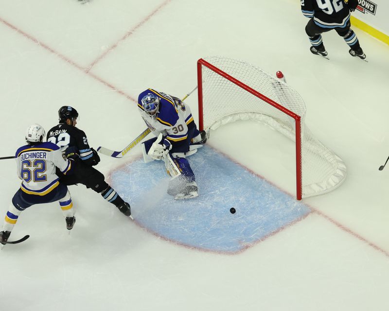 Sep 22, 2024; Des Moines, Iowa, USA; St. Louis Blues goaltender Joel Hofer (30) makes a save against the Utah Hockey Club at Wells Fargo Arena. Mandatory Credit: Reese Strickland-Imagn Images

