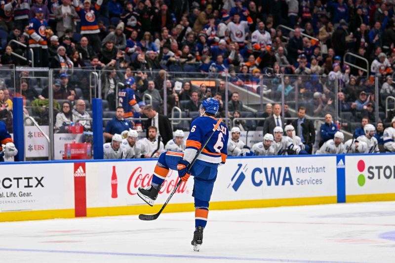 Feb 8, 2024; Elmont, New York, USA; New York Islanders defenseman Ryan Pulock (6) celebrates his goal against the Tampa Bay Lightning during the second period at UBS Arena. Mandatory Credit: Dennis Schneidler-USA TODAY Sports