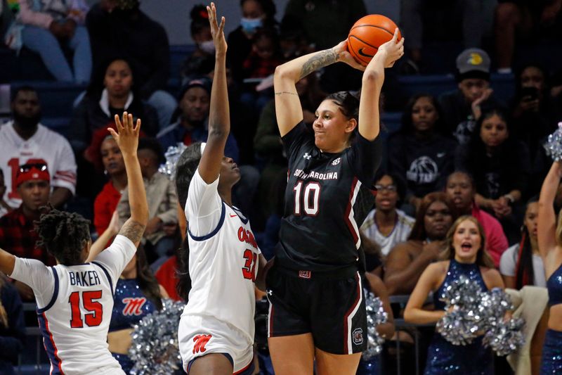 Feb 19, 2023; Oxford, Mississippi, USA; South Carolina Gamecocks center Kamilla Cardoso (10) handles the ball as Mississippi Rebels center Rita Igbokwe (32) defends during the second half at The Sandy and John Black Pavilion at Ole Miss. Mandatory Credit: Petre Thomas-USA TODAY Sports
