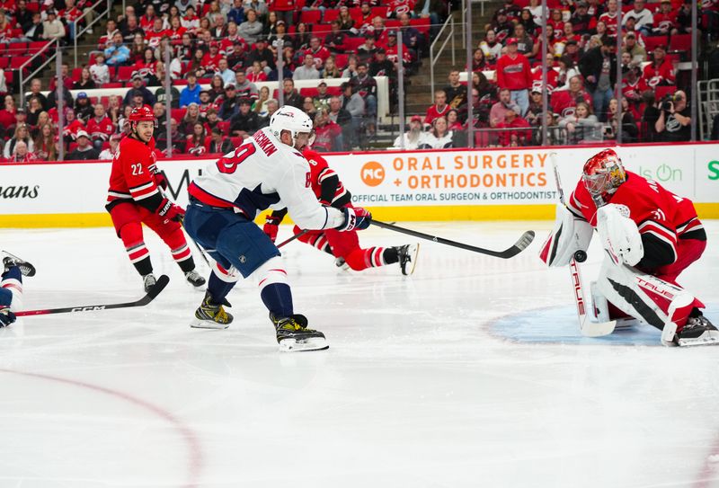 Apr 2, 2025; Raleigh, North Carolina, USA;  Washington Capitals left wing Alex Ovechkin (8) shot its stopped by Carolina Hurricanes goaltender Frederik Andersen (31) during the second period at Lenovo Center. Mandatory Credit: James Guillory-Imagn Images