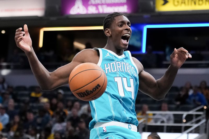 INDIANAPOLIS, INDIANA - OCTOBER 17: Moussa Diabate #14 of the Charlotte Hornets reacts after dunking the ball in the second quarter against the Indiana Pacers during a preseason game at Gainbridge Fieldhouse on October 17, 2024 in Indianapolis, Indiana. NOTE TO USER: User expressly acknowledges and agrees that, by downloading and or using this photograph, User is consenting to the terms and conditions of the Getty Images License Agreement. (Photo by Dylan Buell/Getty Images)