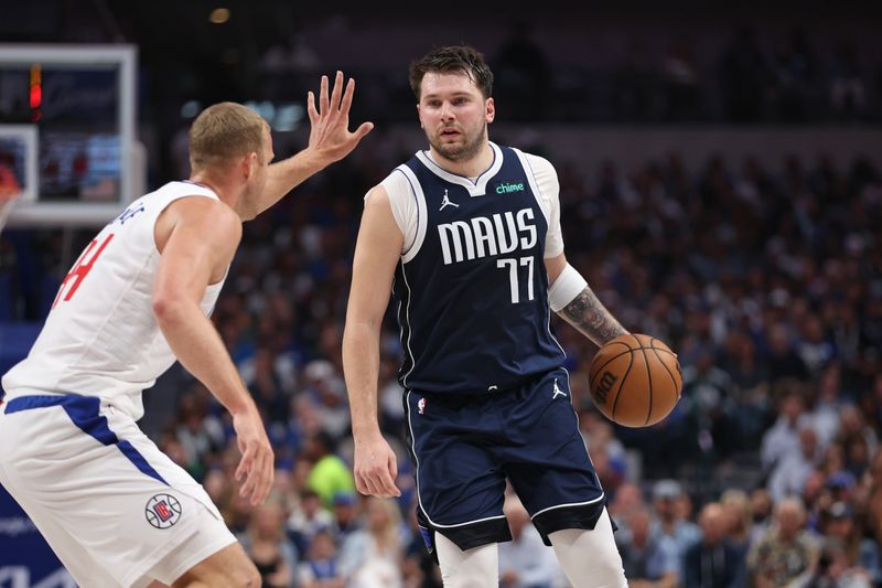 DALLAS, TX - APRIL 28: Luka Doncic #77 of the Dallas Mavericks dribbles the ball during the game against the LA Clippers during Round 1 Game 4 of the 2024 NBA Playoffs on April 28, 2024 at the American Airlines Center in Dallas, Texas. NOTE TO USER: User expressly acknowledges and agrees that, by downloading and or using this photograph, User is consenting to the terms and conditions of the Getty Images License Agreement. Mandatory Copyright Notice: Copyright 2024 NBAE (Photo by Tim Heitman/NBAE via Getty Images)