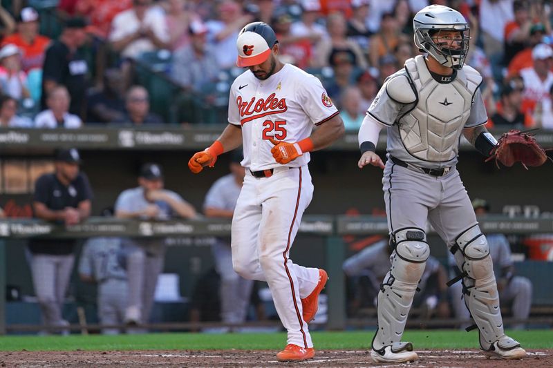 Sep 2, 2024; Baltimore, Maryland, USA; Baltimore Orioles designated hitter Anthony Santander (25) scores during the sixth inning on a double by outfielder Cedric Mullins (not shown) against the Chicago White Sox at Oriole Park at Camden Yards. Mandatory Credit: Mitch Stringer-USA TODAY Sports