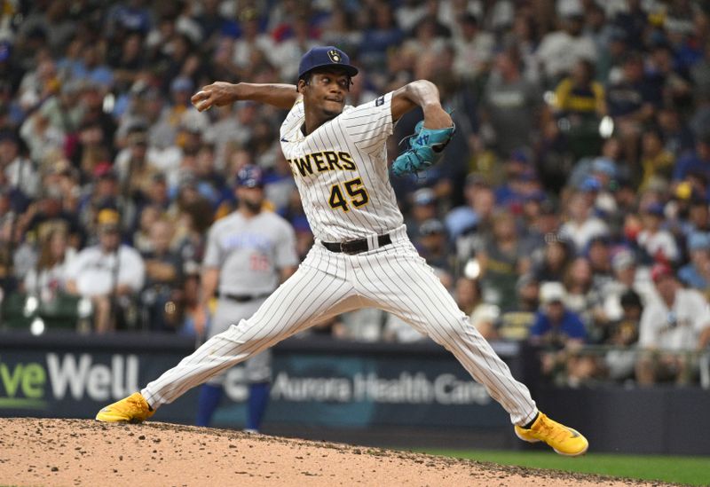 Sep 30, 2023; Milwaukee, Wisconsin, USA; Milwaukee Brewers relief pitcher Abner Uribe (45) delivers a pitch against the Chicago Cubs in the sixth inning at American Family Field. Mandatory Credit: Michael McLoone-USA TODAY Sports