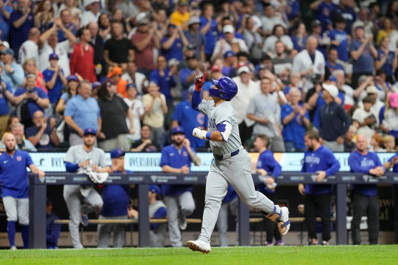 Jun 28, 2024; Milwaukee, Wisconsin, USA;  Chicago Cubs designated hitter Seiya Suzuki (27) celebrates while rounding the bases after hitting a home run during the fourth inning against the Milwaukee Brewers at American Family Field. Mandatory Credit: Jeff Hanisch-USA TODAY Sports