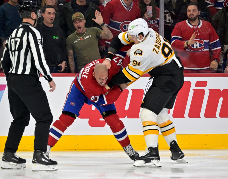 Nov 15, 2025; Montreal, Quebec, CAN; Montreal Canadiens defenseman Jayden Struble (47) fights Boston Bruins defenseman Nikita Zadorov (91) during the first period at the Bell Centre. Mandatory Credit: Eric Bolte-Imagn Images