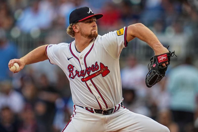 May 29, 2024; Cumberland, Georgia, USA; Atlanta Braves starting pitcher Spencer Schwellenbach (56) pitches against the Washington Nationals during the third inning at Truist Park. Mandatory Credit: Dale Zanine-USA TODAY Sports