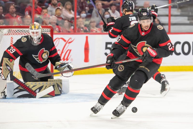 Oct 24, 2022; Ottawa, Ontario, CAN; Ottawa Senators defenseman Travis Hamonic (23) settles the puck in the second period against the Dallas Stars at the Canadian Tire Centre. Mandatory Credit: Marc DesRosiers-USA TODAY Sports