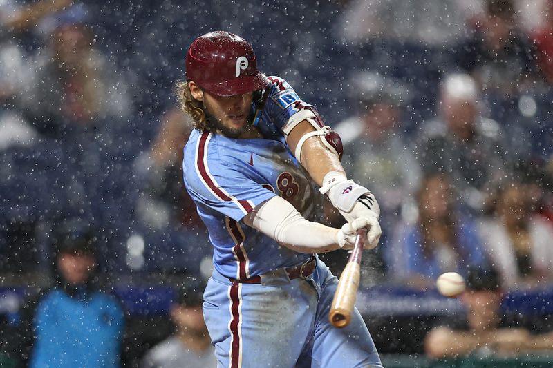 Sep 25, 2025; Philadelphia, Pennsylvania, USA; Philadelphia Phillies third base Alec Bohm (28) hits a single against the Miami Marlins during the eighth inning at Citizens Bank Park. Mandatory Credit: Bill Streicher-Imagn Images