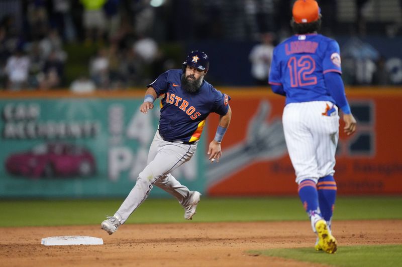 Mar 6, 2025; Port St. Lucie, Florida, USA;  Houston Astros infielder Luis Guillorme (0) goes from first to third base on a base hit in the third inning against the New York Mets at Clover Park. Mandatory Credit: Jim Rassol-Imagn Images