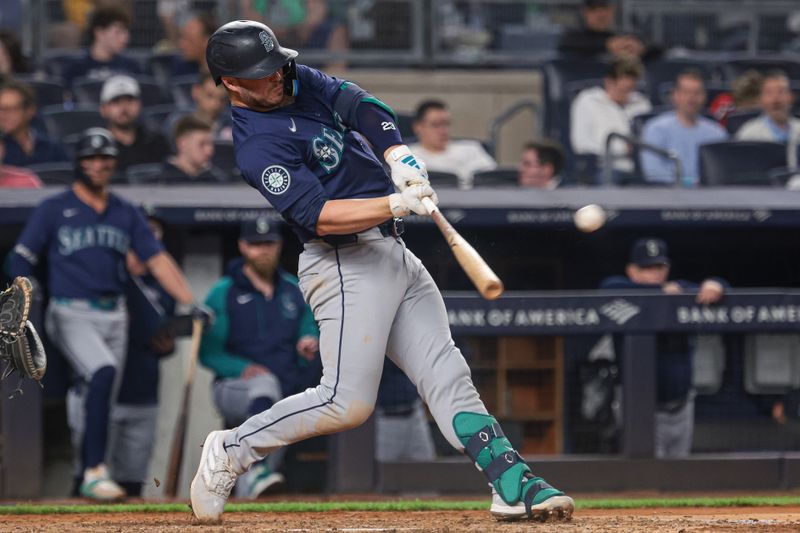 May 21, 2024; Bronx, New York, USA;  Seattle Mariners first baseman Ty France (23) hits a solo home run during the seventh inning against the New York Yankees at Yankee Stadium. Mandatory Credit: Vincent Carchietta-USA TODAY Sports