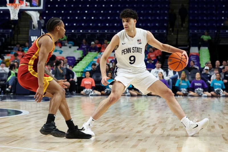 Feb 8, 2026; University Park, Pennsylvania, USA; Penn State Nittany Lions guard Melih Tunca (9) dribbles the ball as Southern California Trojans guard Jordan Marsh (7) defends during the first half at Bryce Jordan Center. Mandatory Credit: Matthew O'Haren-Imagn Images