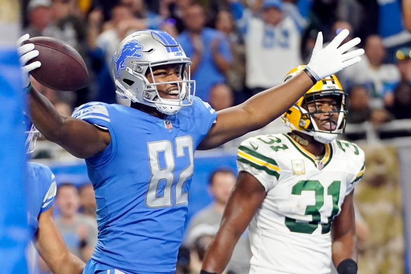 Detroit Lions tight end James Mitchell (82) reacts after 3-yard reception for a touchdown during the second half of an NFL football game against the Green Bay Packers, Sunday, Nov. 6, 2022, in Detroit. (AP Photo/Paul Sancya)