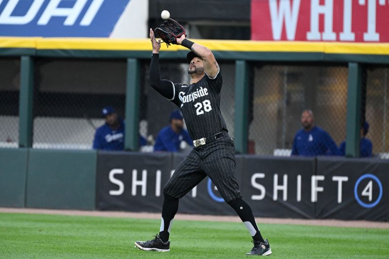 Jun 24, 2024; Chicago, Illinois, USA;  Chicago White Sox outfielder Tommy Pham (28) catches a fly ball hit by Los Angeles Dodgers catcher Will Smith (16) during the first inning at Guaranteed Rate Field. Mandatory Credit: Matt Marton-USA TODAY Sports