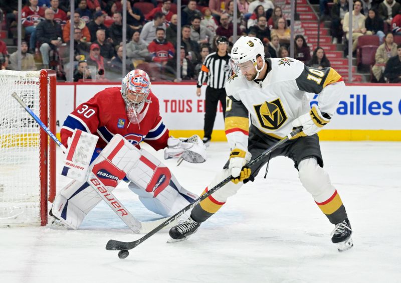 Nov 16, 2023; Montreal, Quebec, CAN; Montreal Canadiens goalie Cayden Primeau (30) and Vegas Golden Knights forward Nicolas Roy (10) during the first period at the Bell Centre. Mandatory Credit: Eric Bolte-USA TODAY Sports