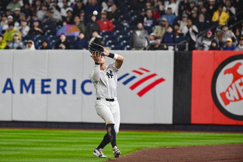 May 5, 2025; Bronx, New York, USA; New York Yankees outfielder Aaron Judge (99) catches a fly ball hit by San Diego Padres catcher Elias Díaz (not pictured) during the fifth inning at Yankee Stadium. Mandatory Credit: John Jones-Imagn Images