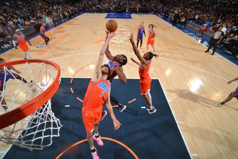 NEW YORK, NY - MARCH 31: Chet Holmgren #7 of the Oklahoma City Thunder blocks the basket during the game against the New York Knicks on March 31, 2024 at Madison Square Garden in New York City, New York.  NOTE TO USER: User expressly acknowledges and agrees that, by downloading and or using this photograph, User is consenting to the terms and conditions of the Getty Images License Agreement. Mandatory Copyright Notice: Copyright 2024 NBAE  (Photo by Jesse D. Garrabrant/NBAE via Getty Images)