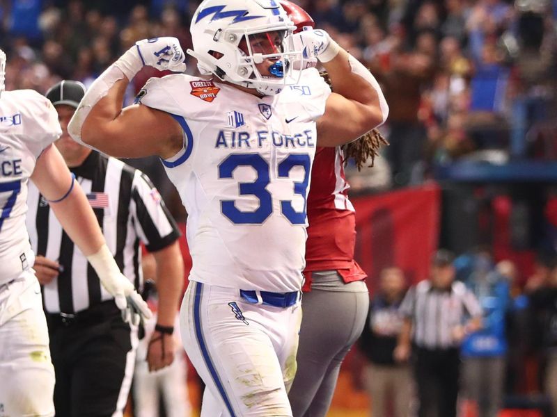 Dec 27, 2019; Phoenix, Arizona, USA; Air Force Falcons fullback Taven Birdow (33) celebrates after scoring a touchdown against the Washington State Cougars during the first half of the Cheez-It Bowl at Chase Field. Mandatory Credit: Mark J. Rebilas-USA TODAY Sports