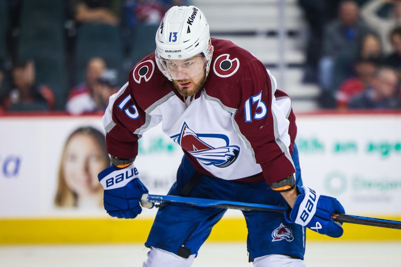 Mar 12, 2024; Calgary, Alberta, CAN; Colorado Avalanche right wing Valeri Nichushkin (13) during the face off against the Calgary Flames during the third period at Scotiabank Saddledome. Mandatory Credit: Sergei Belski-USA TODAY Sports