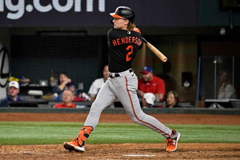 Oct 10, 2023; Arlington, Texas, USA; Baltimore Orioles third baseman Gunnar Henderson (2) hits an RBI single against the Texas Rangers in the fifth inning during game three of the ALDS for the 2023 MLB playoffs at Globe Life Field. Mandatory Credit: Jerome Miron-USA TODAY Sports